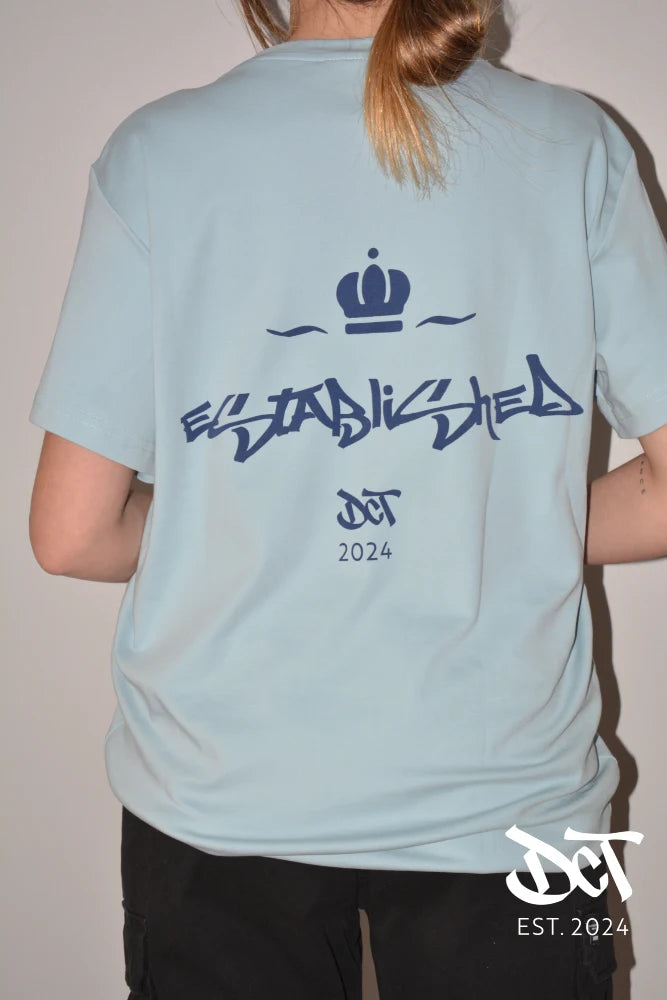 Polera Algodón Corona Celeste | dctestablished.cl